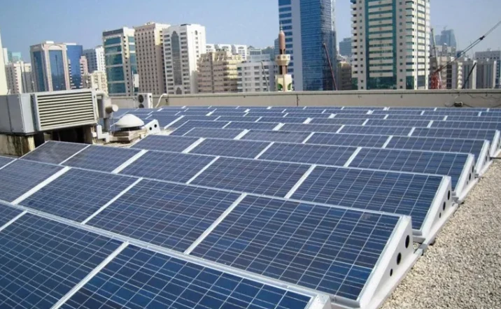Solar panels on a flat roof in a city